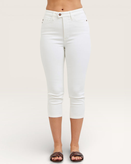 White capri pants worn by a person on a plain background