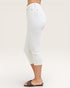 White capri pants worn by a person on a plain background
