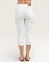 White jeans worn by a person on a plain background