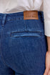 Blue jeans with a Judy Blue label on the back pocket, worn by a person.
