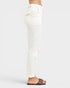 White pants worn by a person on a white background