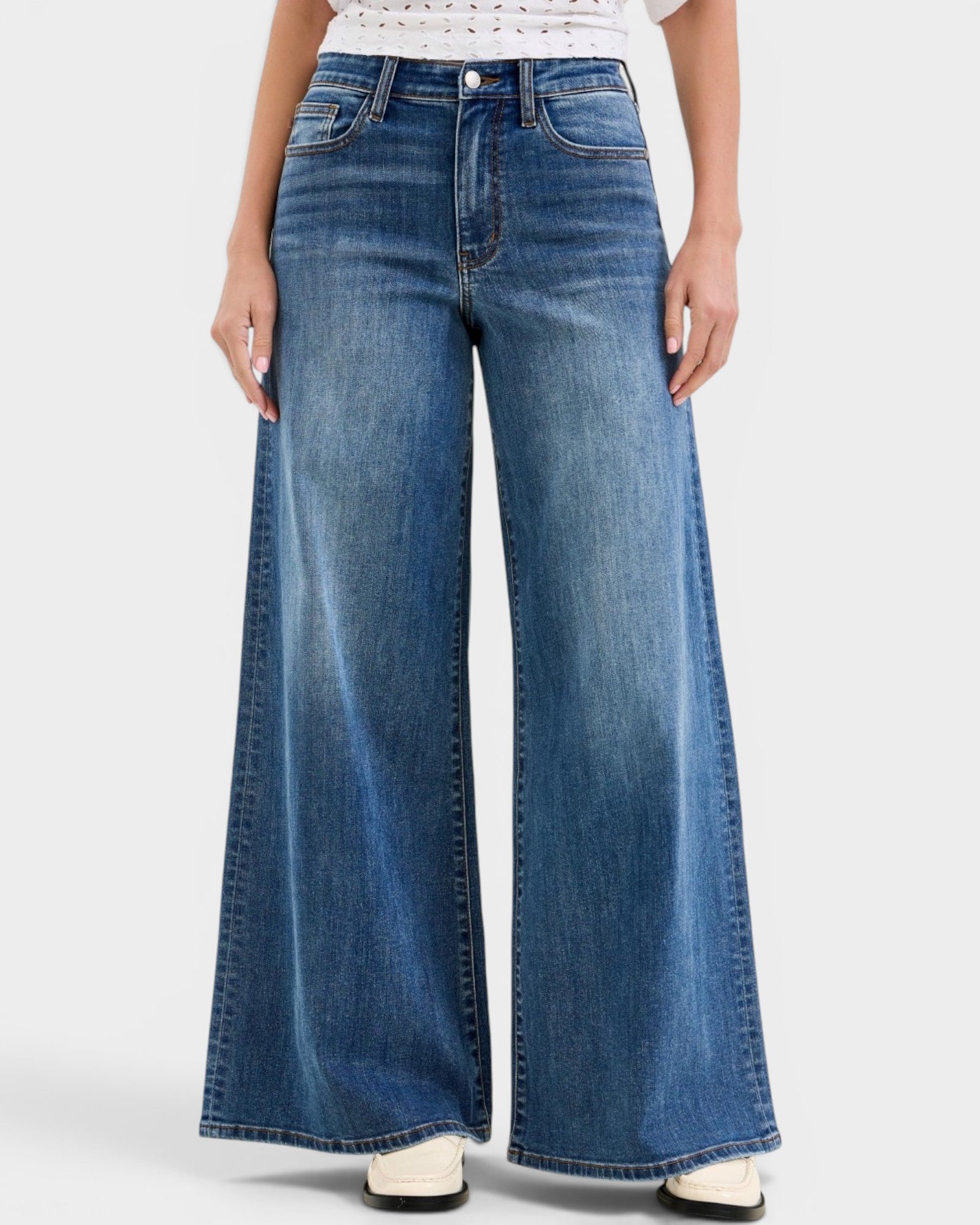Wide-leg jeans worn by a person on a white background