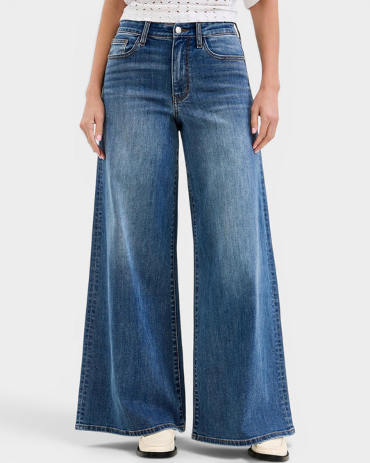 Wide-leg jeans worn by a person on a white background