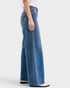 Person wearing blue jeans on a white background