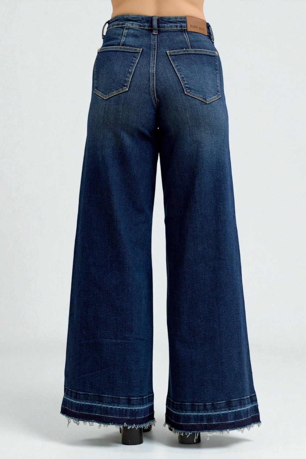 Blue wide-leg jeans on a white background