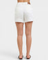 White shorts worn by a person on a white background