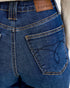 Close-up of blue jeans with a Judy Blue label on the pocket.
