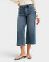Person wearing blue jeans on a white background