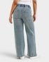 Light blue jeans worn by a person on a white background