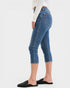 Person wearing blue jeans on a white background