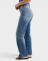 Person wearing blue jeans on a white background