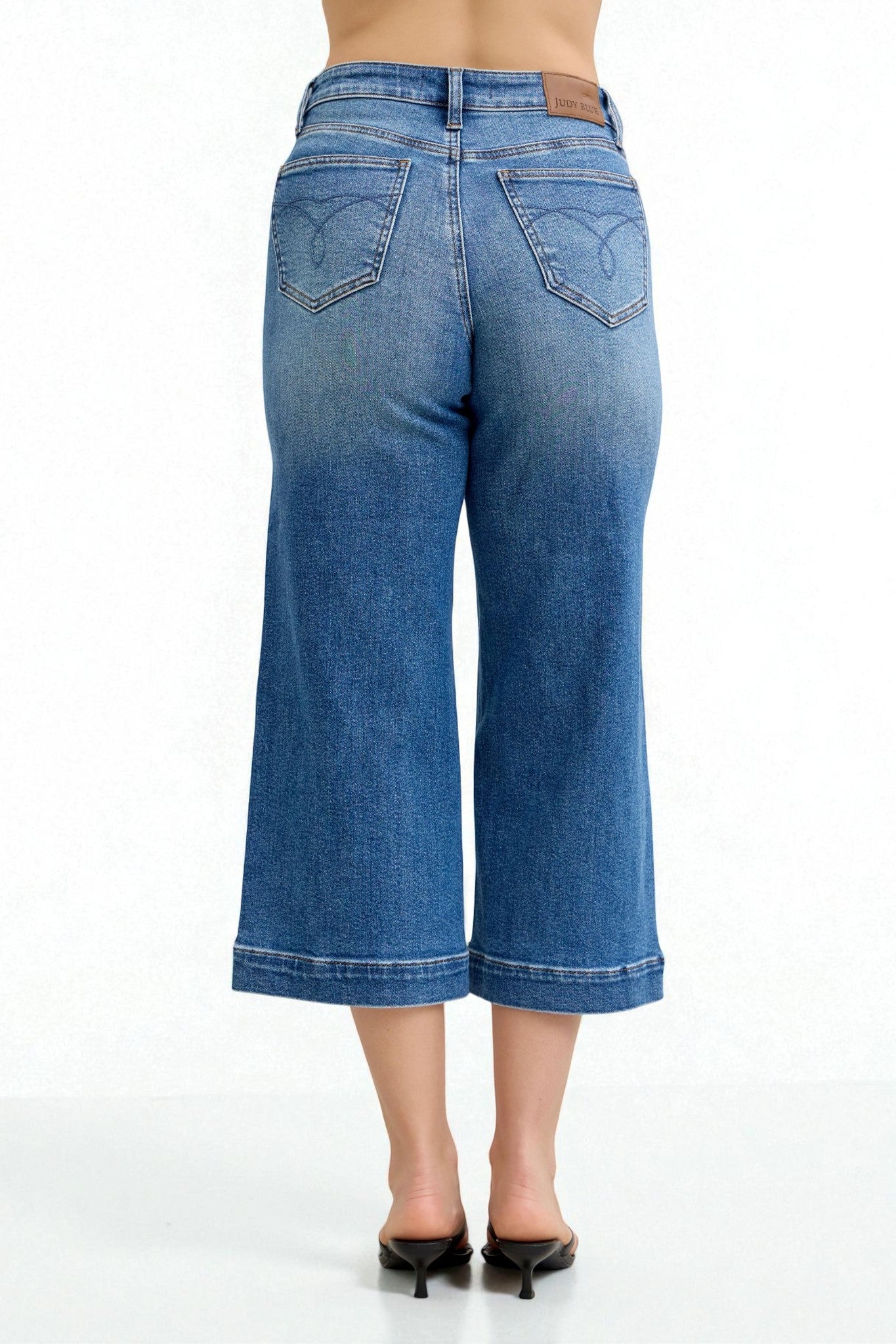 Blue denim wide-leg jeans on a white background