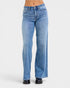 Blue jeans worn by a person on a white background