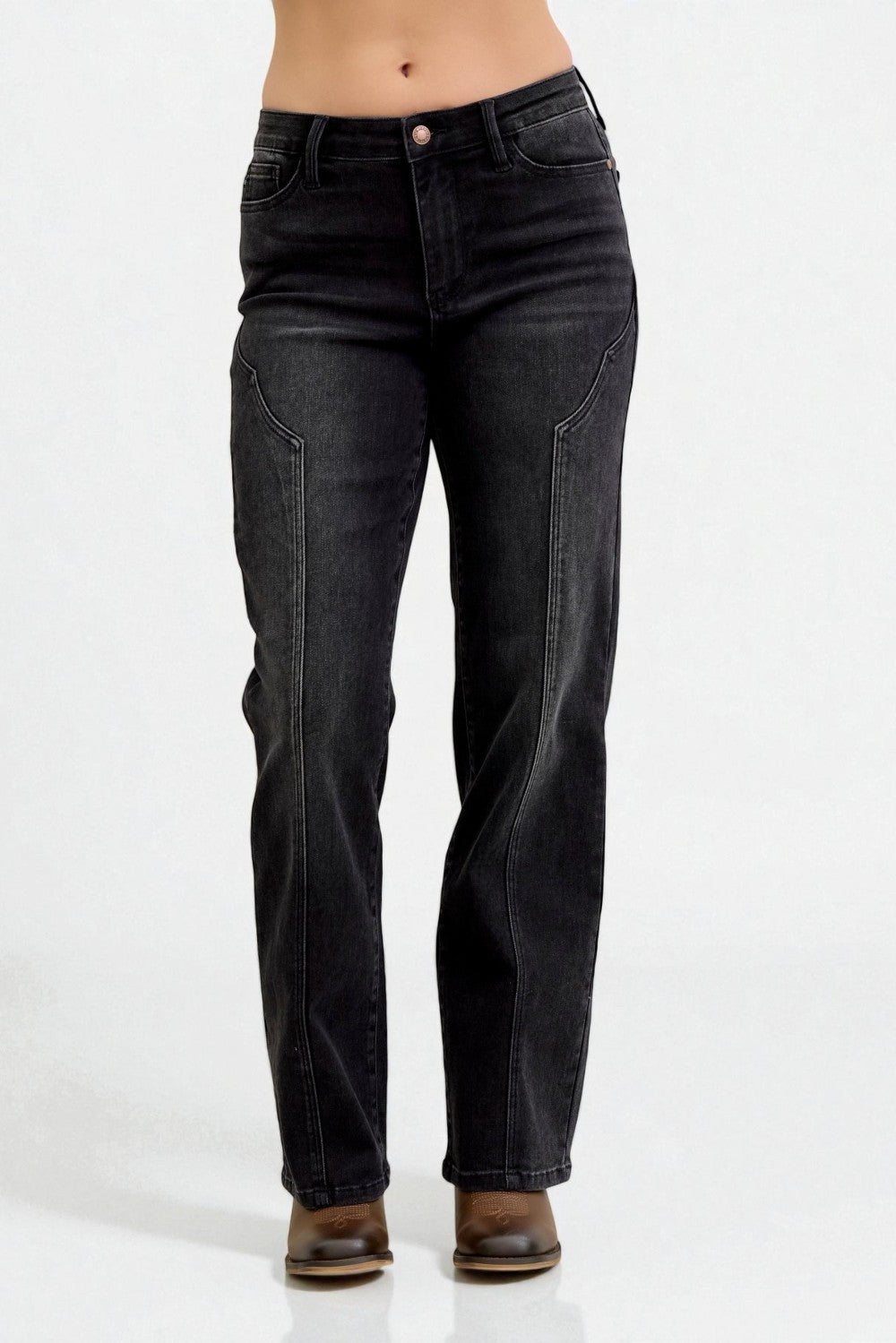 Black jeans worn by a person on a white background
