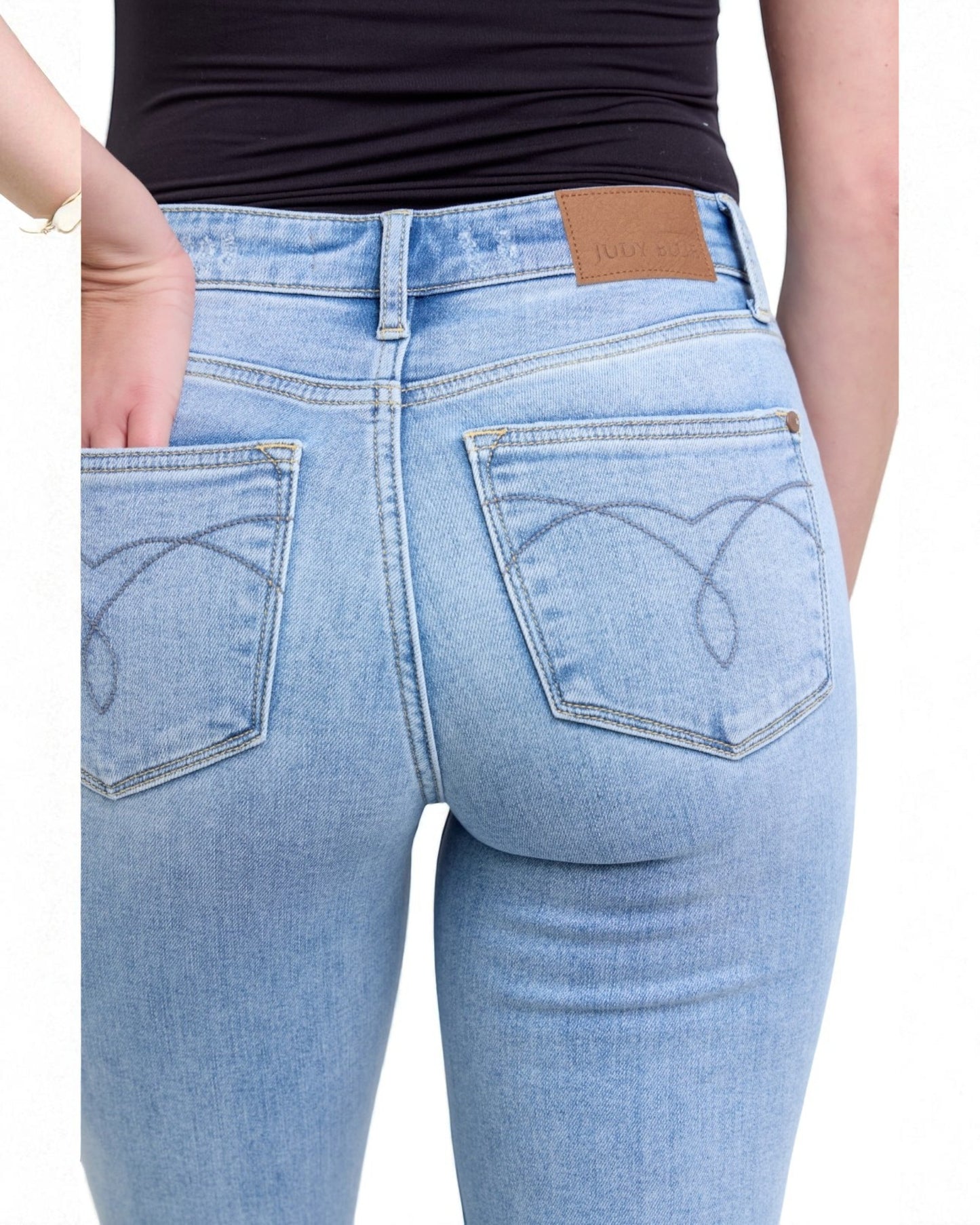 Light blue jeans with a brand label on a white background