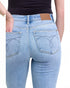 Light blue jeans with a brand label on a white background