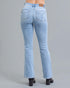 Light blue jeans worn by a person on a gray background