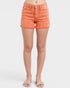 Person wearing orange denim shorts on a white background