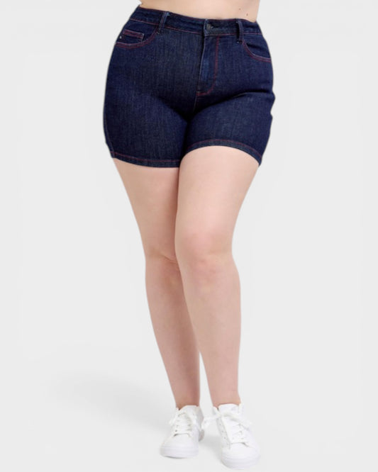 Person wearing dark blue denim shorts on a white background