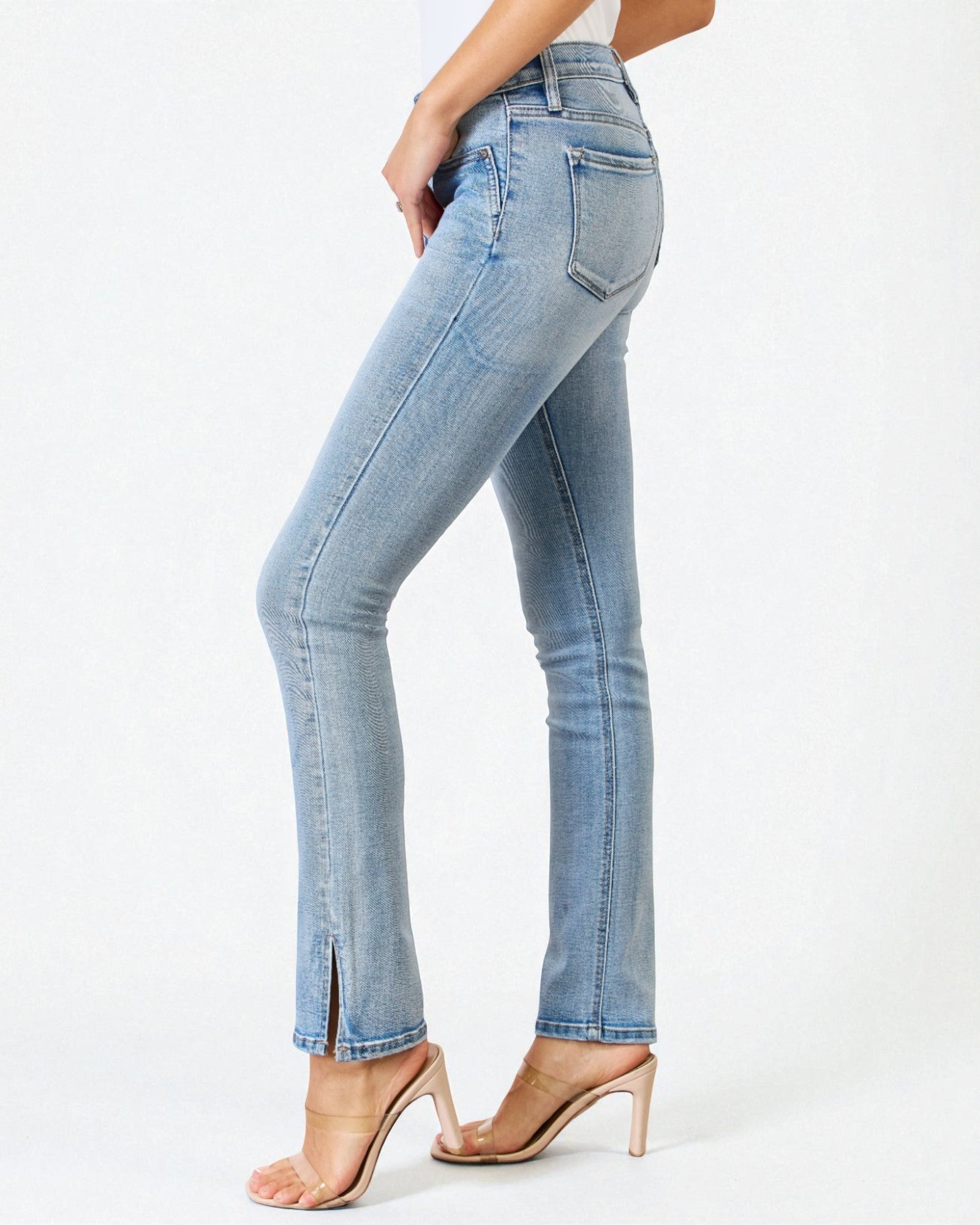 Light blue jeans worn by a person on a white background