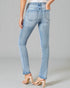 Light blue jeans worn by a person on a gray background