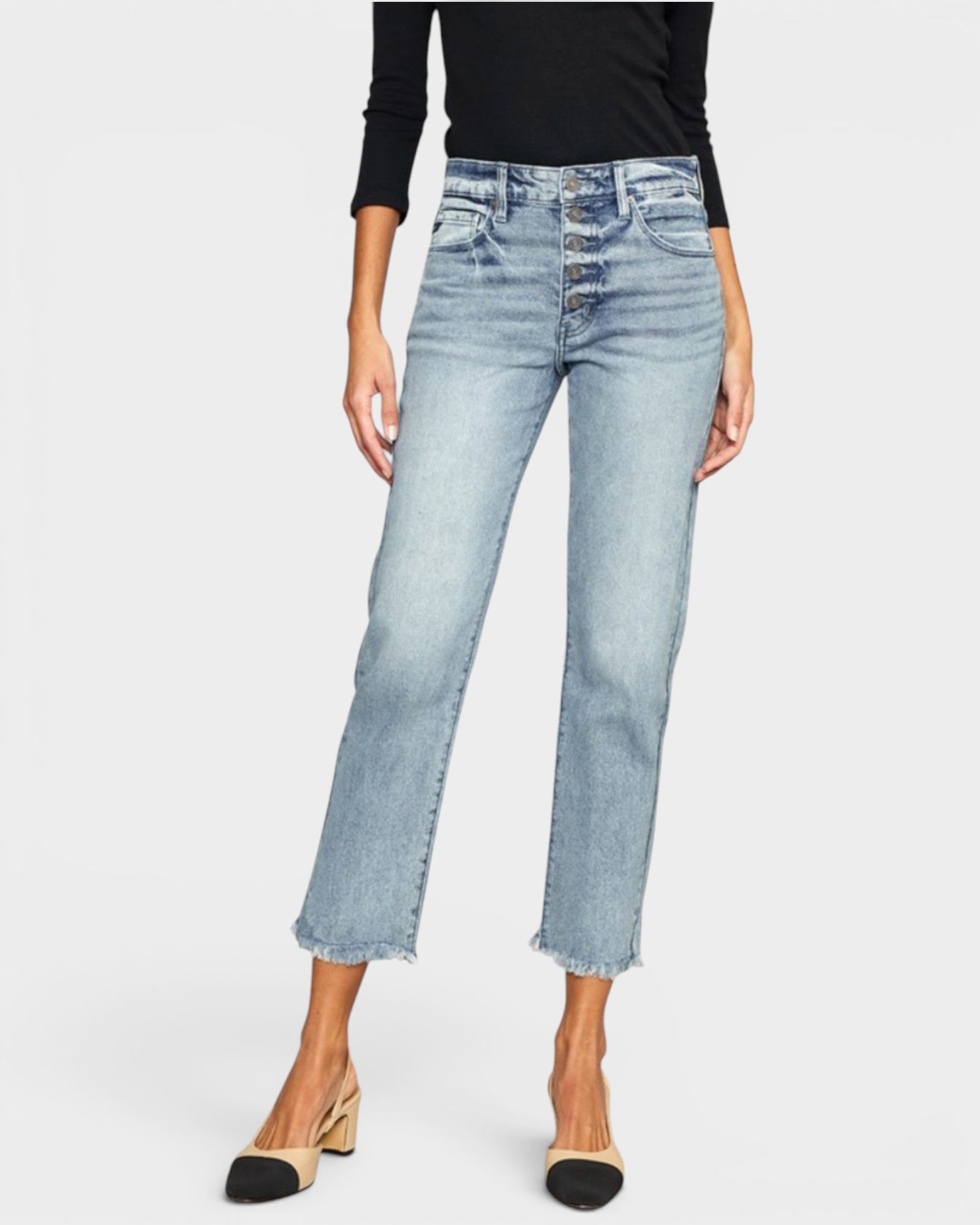 Light blue jeans worn by a person on a white background