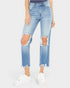 Light blue distressed jeans worn by a person on a white background