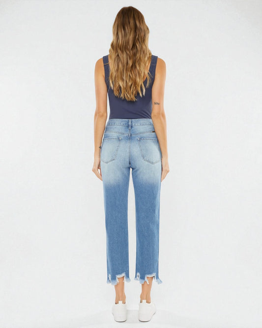 Woman wearing blue denim jeans with a white background