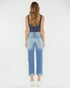 Woman wearing blue denim jeans with a white background