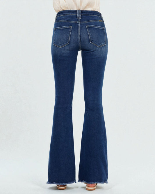 Blue flared jeans on a white background