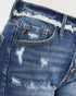 Pantalones cortos de mezclilla con botones y lavado oscuro desgastado
