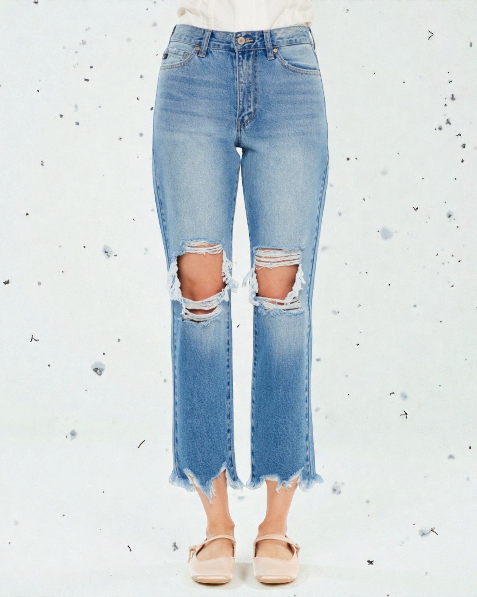 Ripped blue jeans on a white background