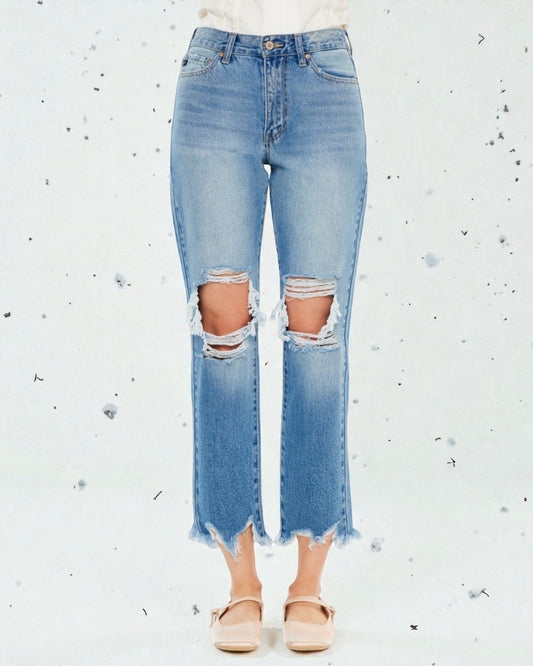 Ripped blue jeans on a white background