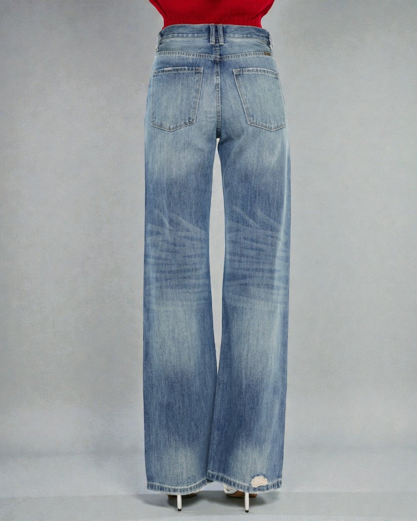 Blue jeans on a gray background