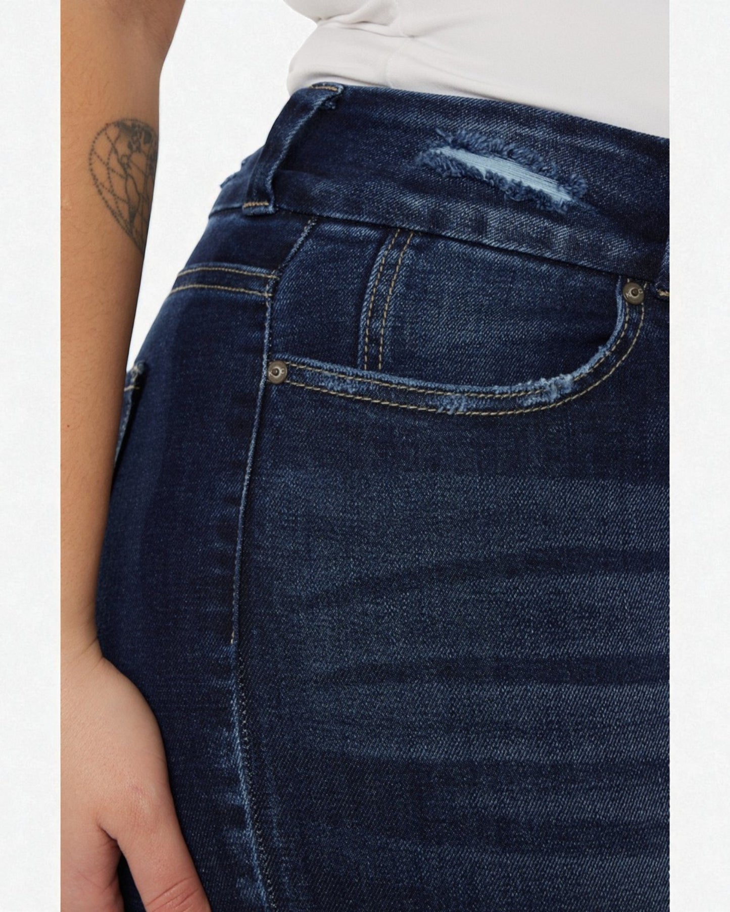 Close-up of blue jeans with a visible pocket and stitching detail.