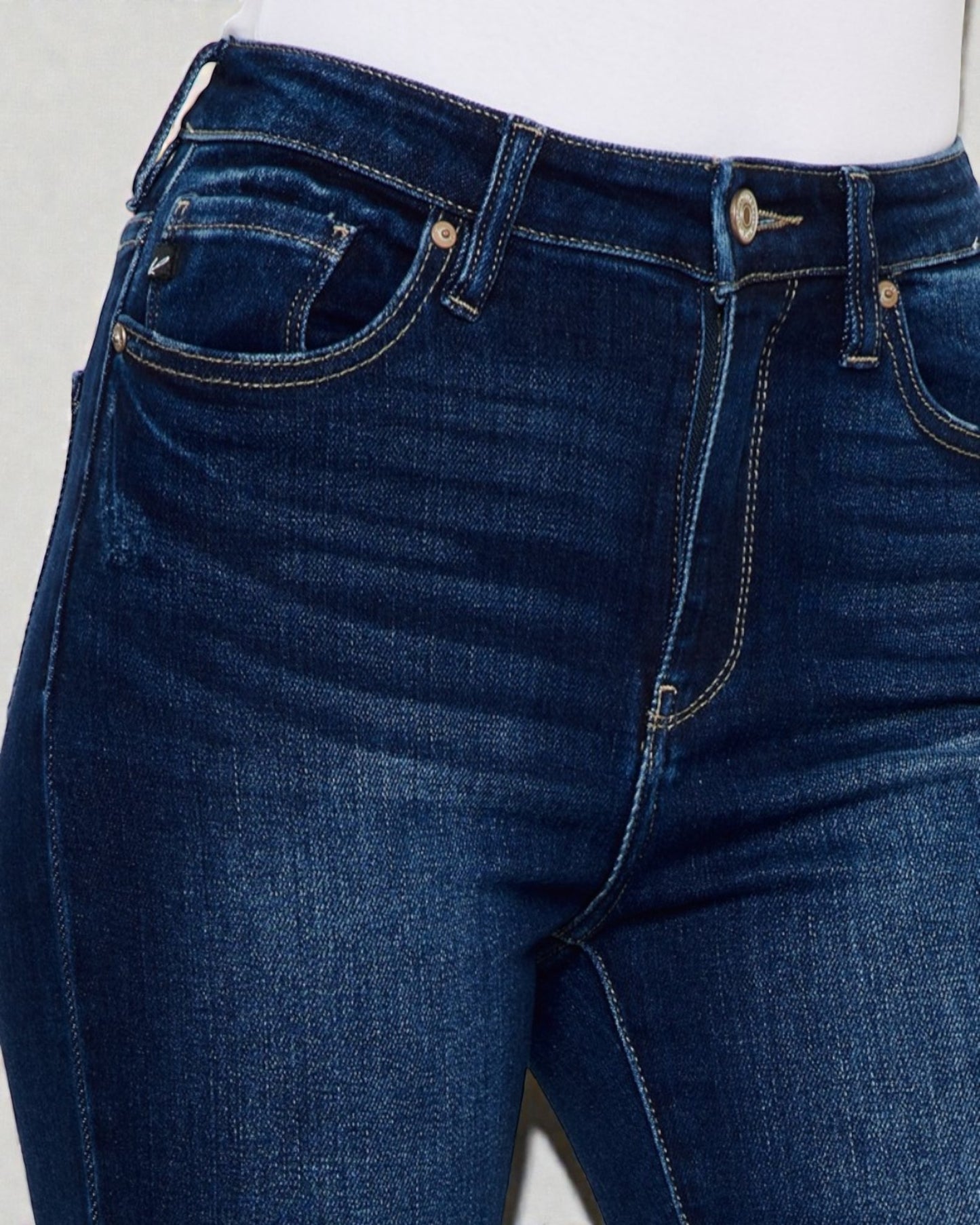 Close-up of blue jeans on a white background