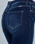 Close-up of blue jeans on a light gray background