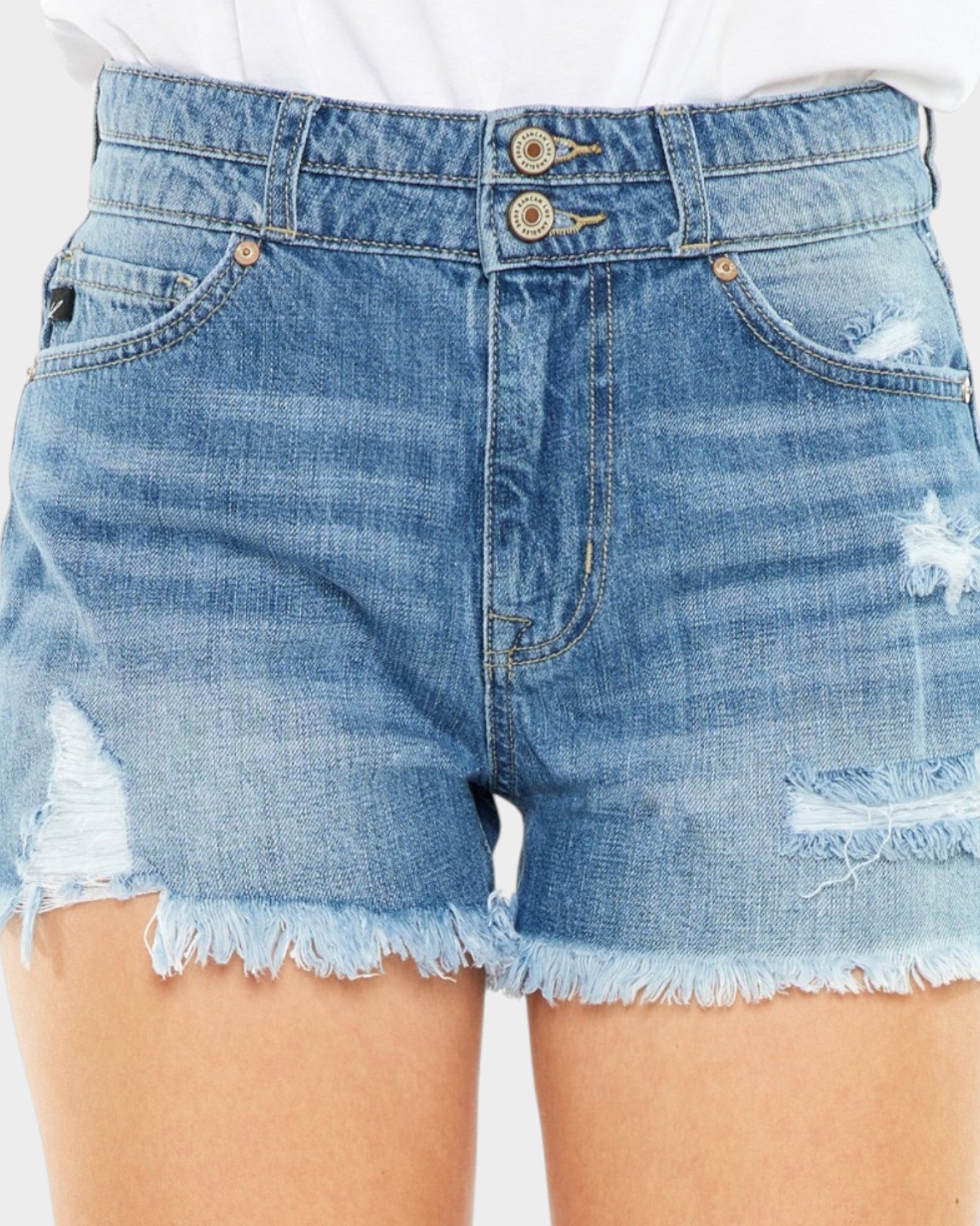 Denim shorts with frayed edges on a white background