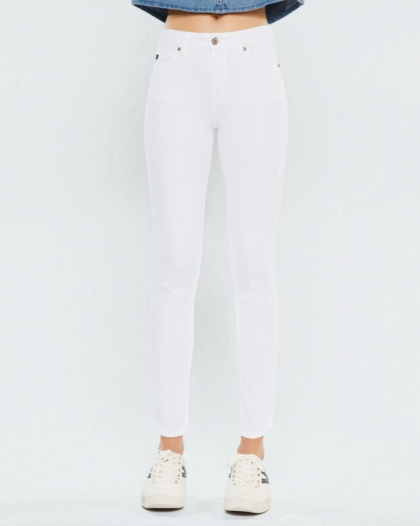 White jeans worn by a person on a white background