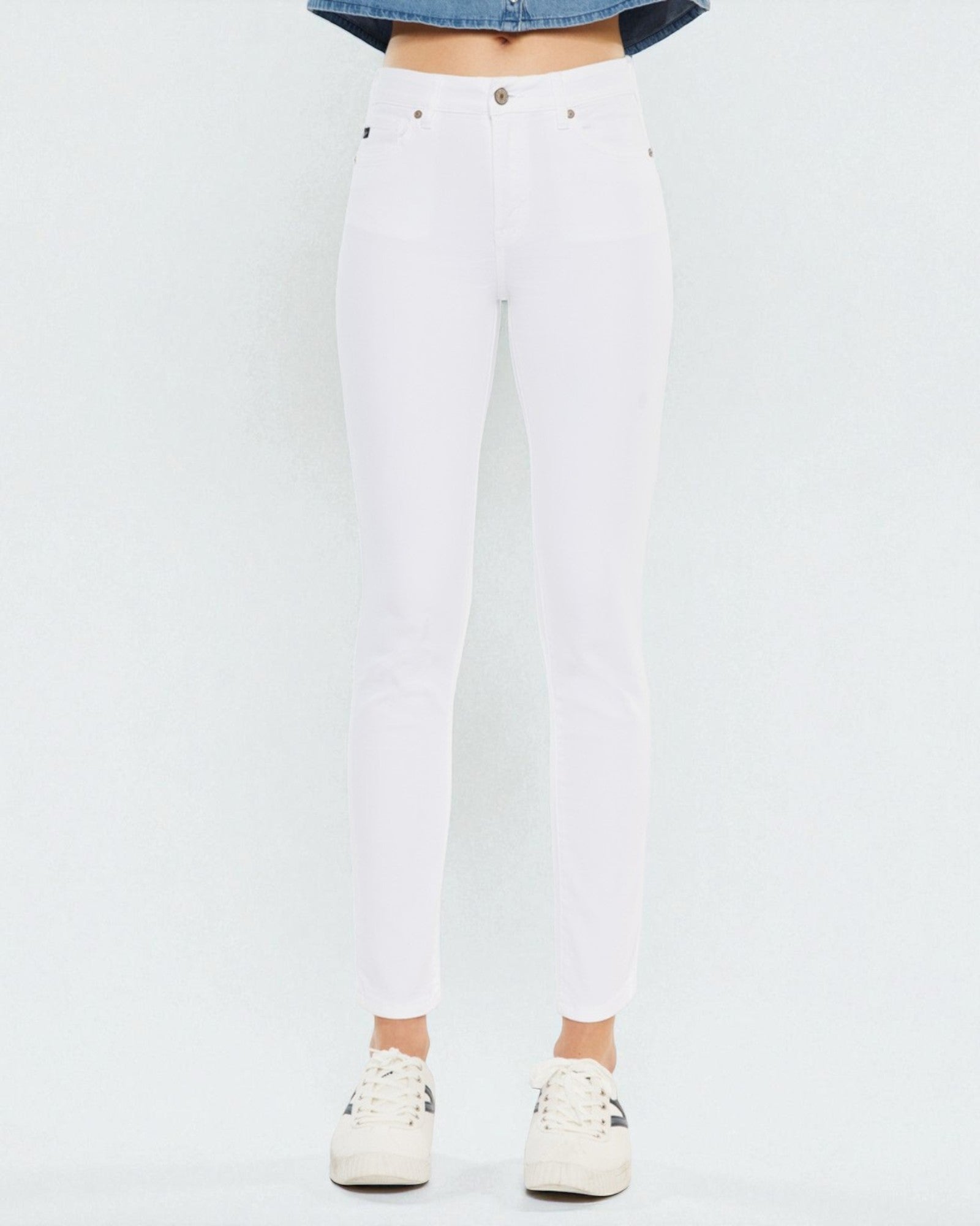 White jeans worn by a person on a white background
