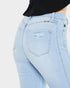 Light blue jeans with a visible brand logo on a plain background