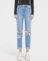 Light blue distressed jeans worn by a person on a white background