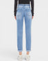 Light blue jeans worn by a person on a white background