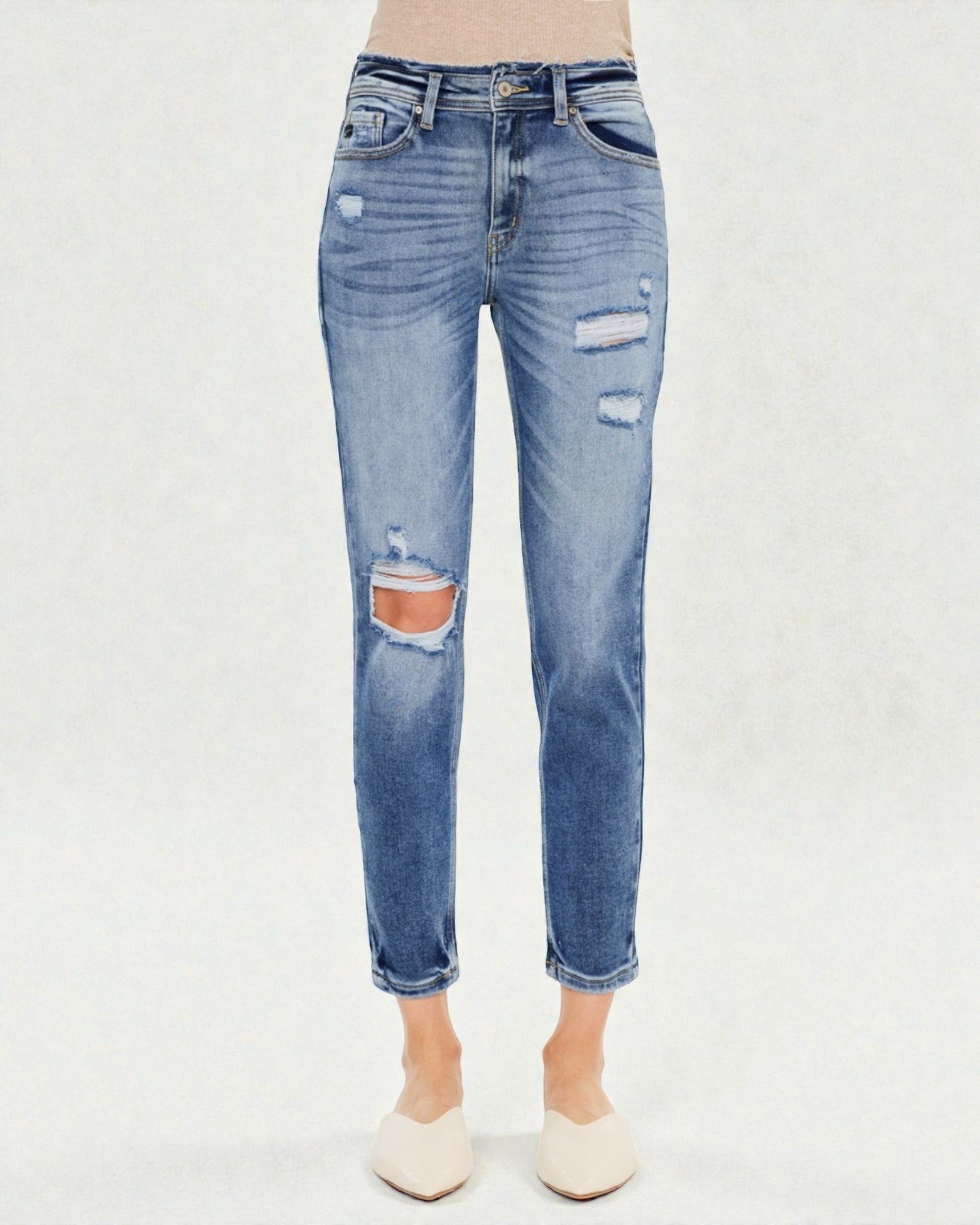 Blue distressed jeans on a white background