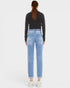 Person wearing light blue jeans on a white background