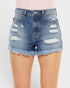 Denim shorts with frayed edges on a plain background