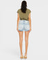 Woman wearing a green t-shirt and light blue denim shorts on a white background