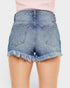 Denim shorts with frayed hem on a plain background