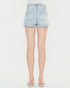 Light blue denim shorts worn by a person on a white background