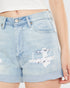 Light blue denim shorts with a graphic design on a plain background